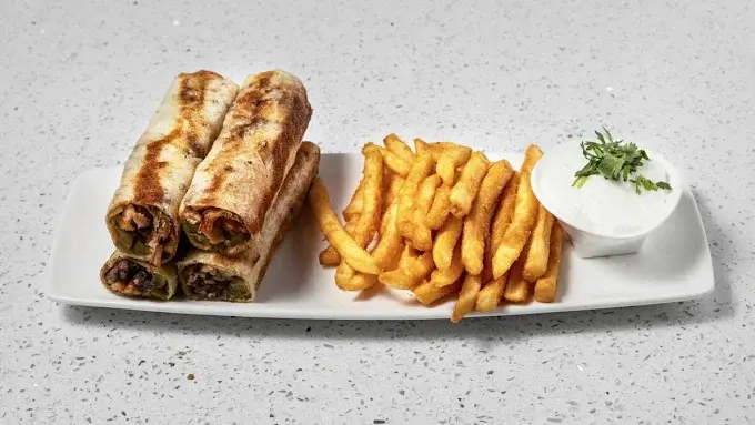 Shawarma poutine topped with halal meat at Original Shawarma Calgary NW